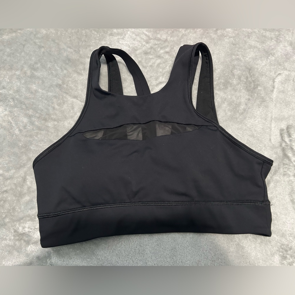 Lululemon High Neck sports Bra size 8. Good used condition. some wear on logo